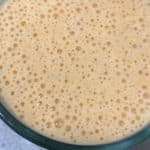 close up of bubbly blended pumpkin spice protein shake smoothie