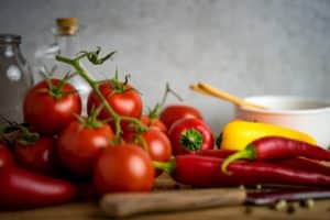 salsa and taco dip ingredients: tomatoes onthe vine and hot peppers